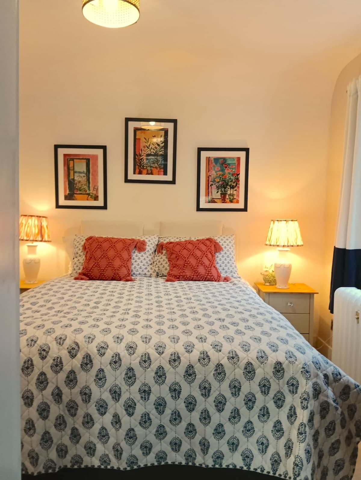 Warm and inviting king-size bed dressed in soft linens.