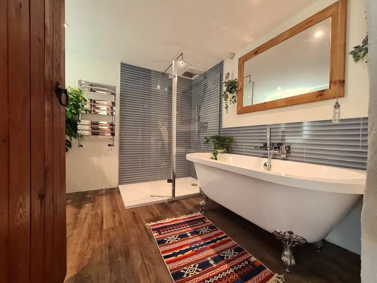 Modern bathroom with bath and shower — unwind and refresh.