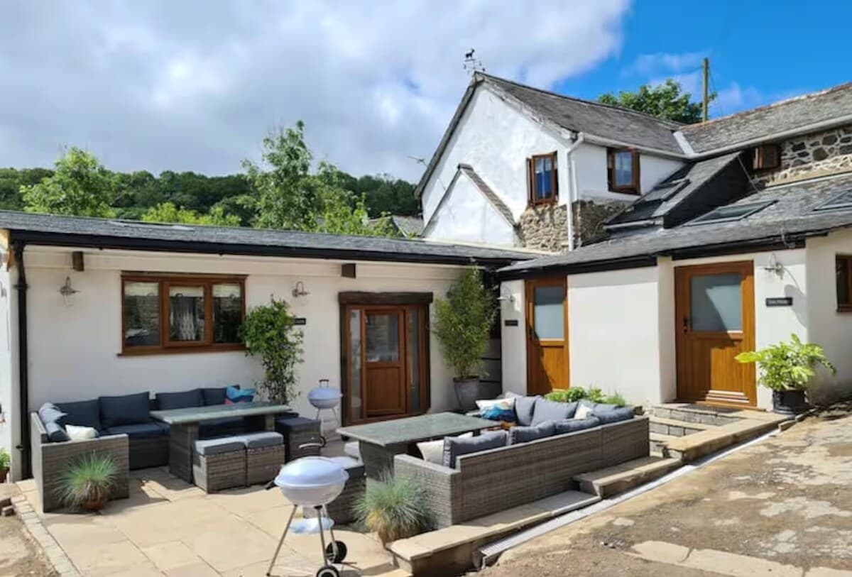 Shared courtyard with comfy outdoor sofas — perfect for sunny afternoons.