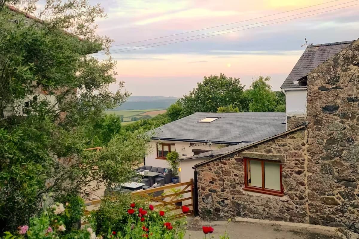 Your Dartmoor view — unwind as the sun sets over the rolling hills.