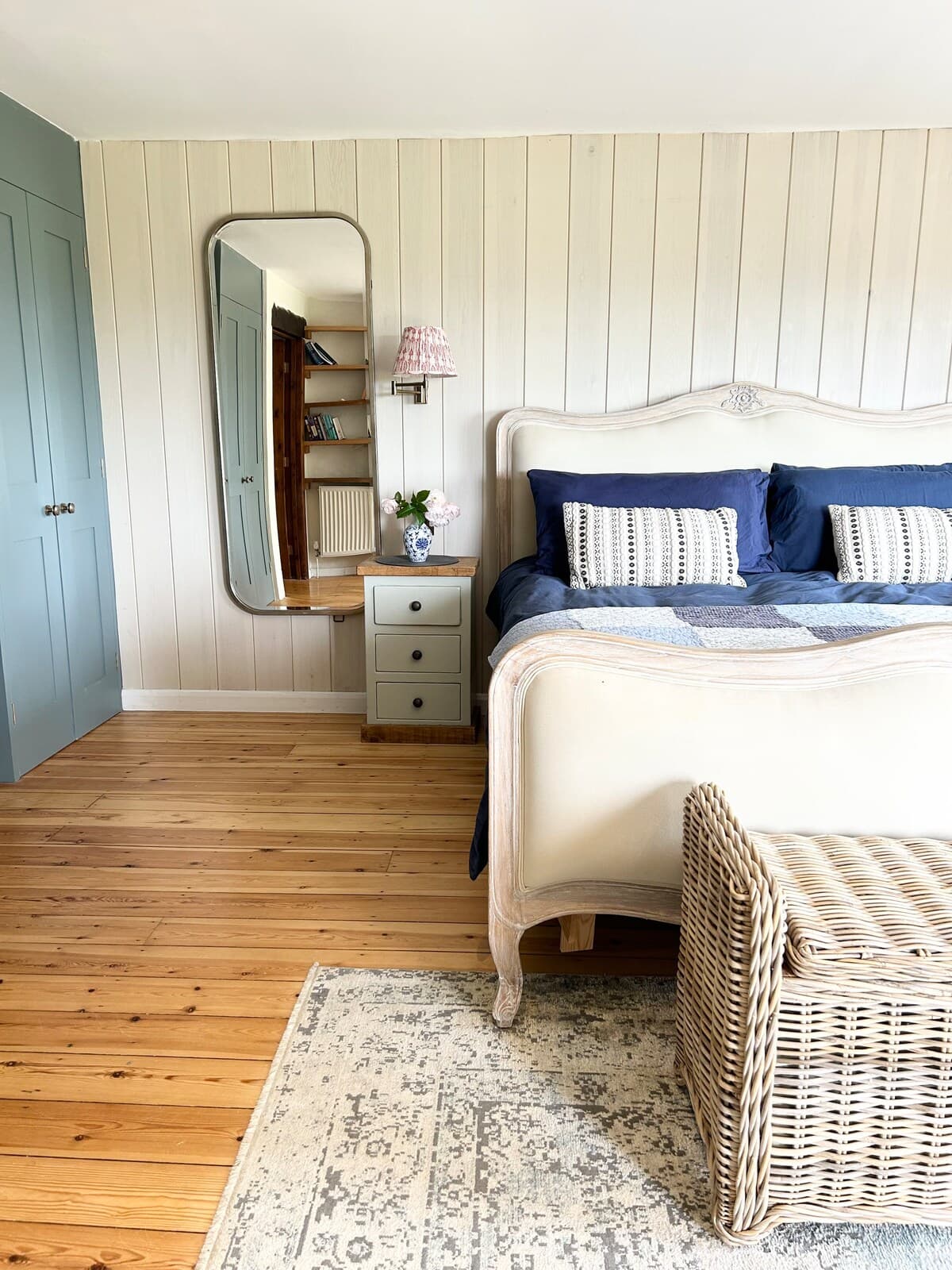 Peaceful king bedroom with soft details and rustic charm.