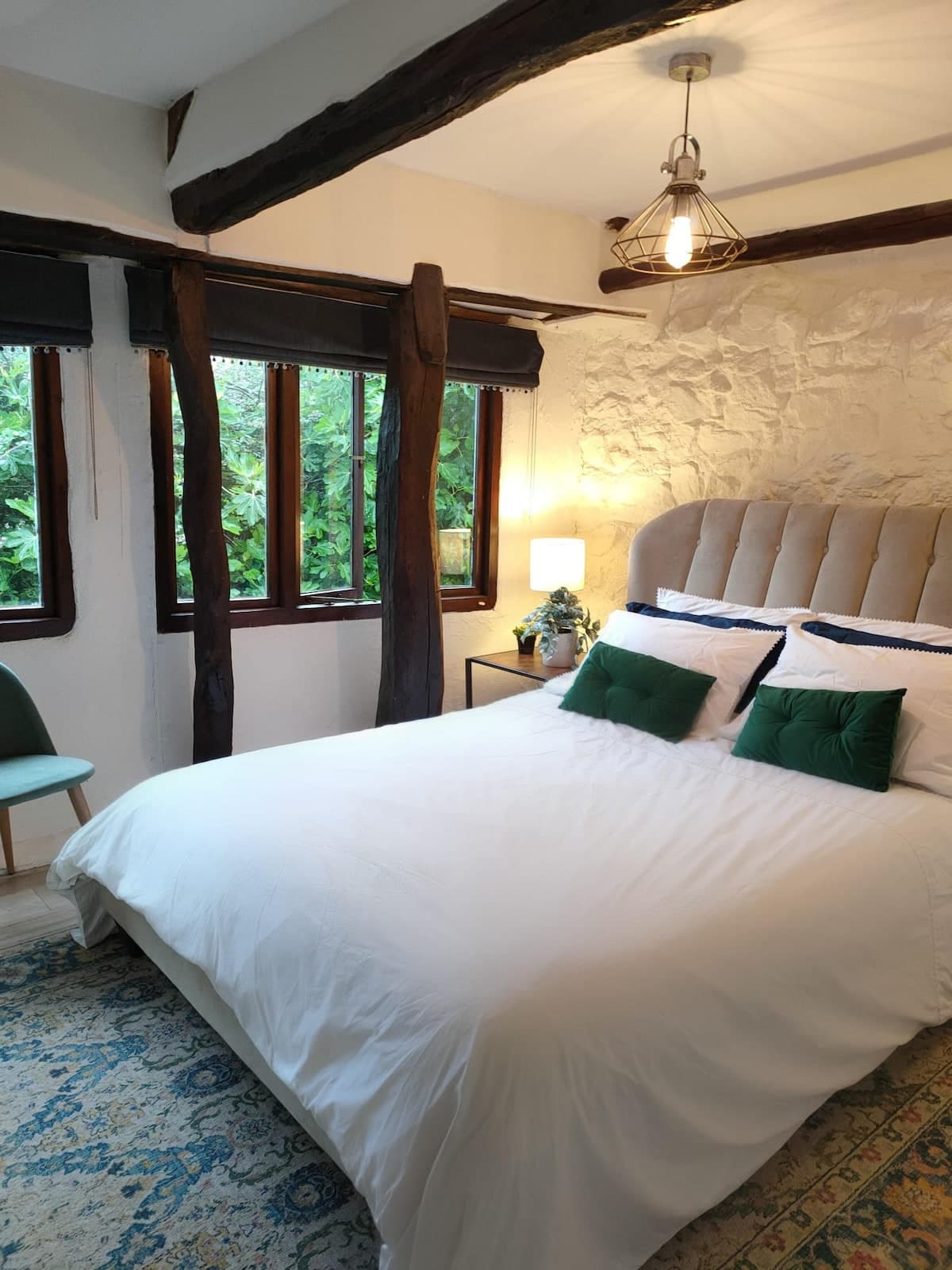 Calm, airy bedroom with king-size bed and green views